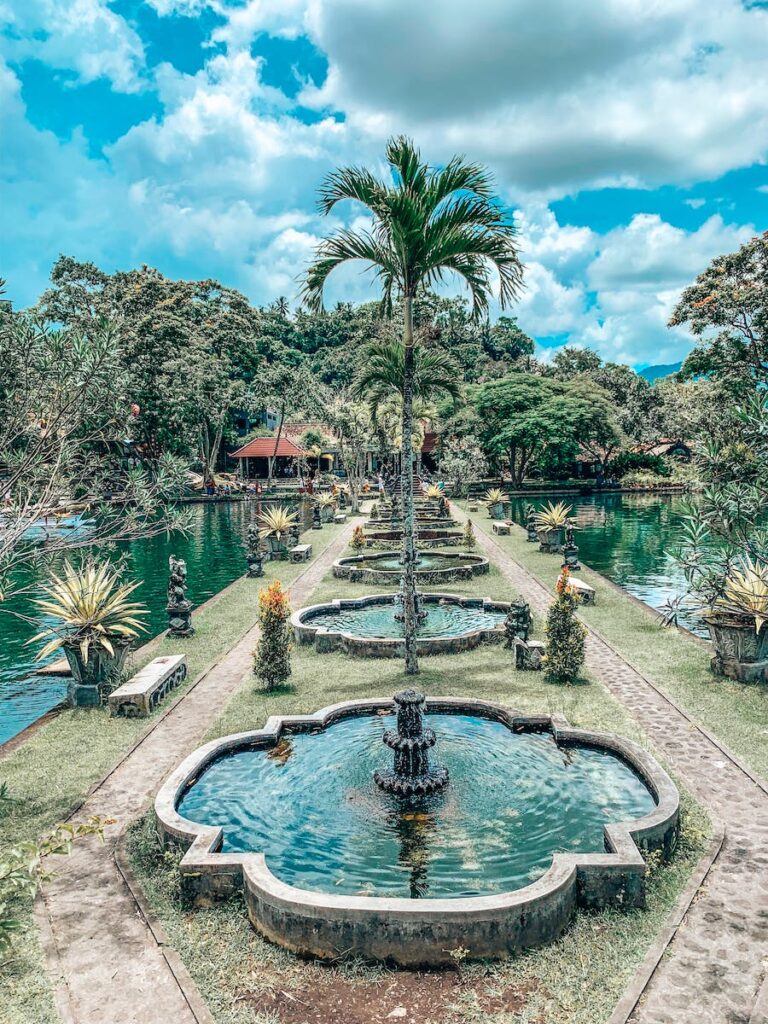 Water Fountains Beside Ponds during Day