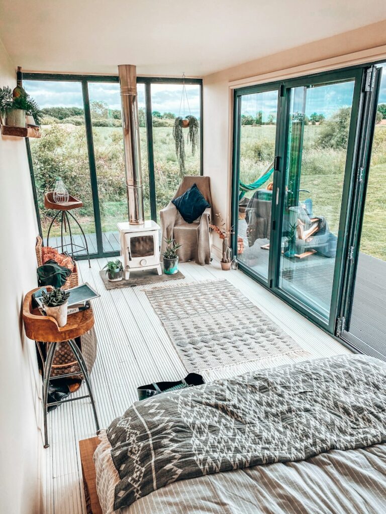 brown wooden chair near glass sliding door