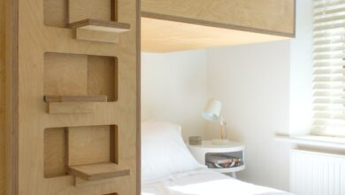 white bed linen near brown wooden bed frame