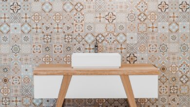 brown wooden table beside white and black wall