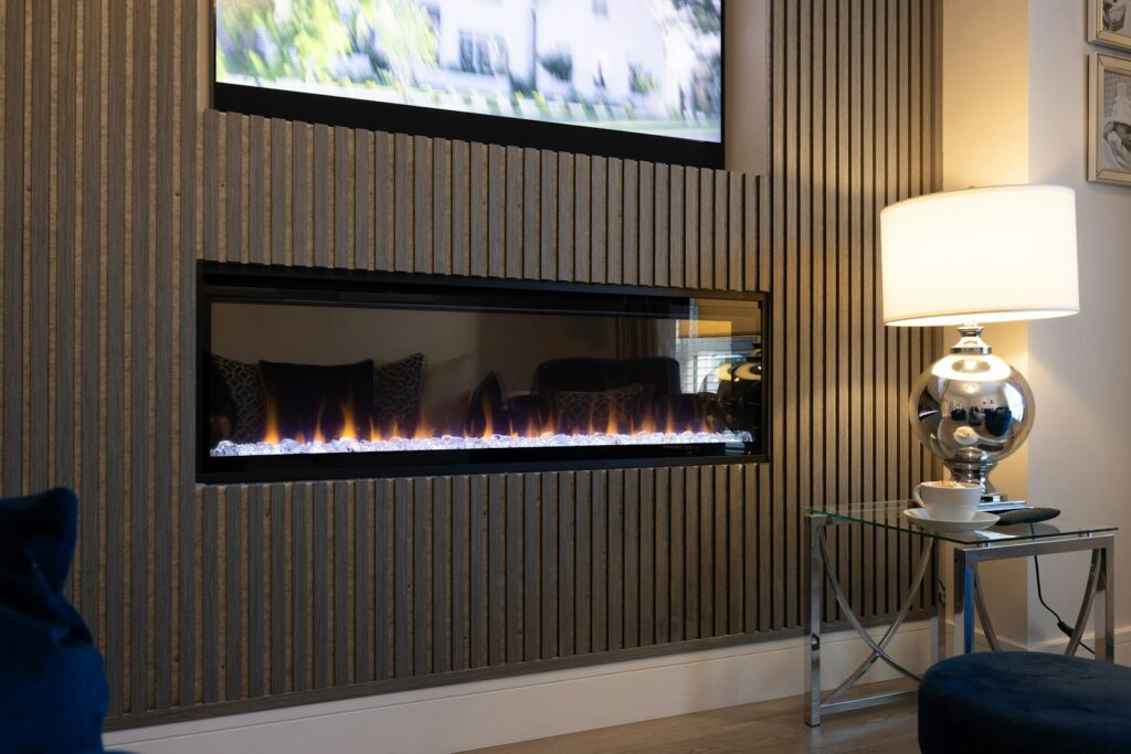 a living room with a television and a fire place